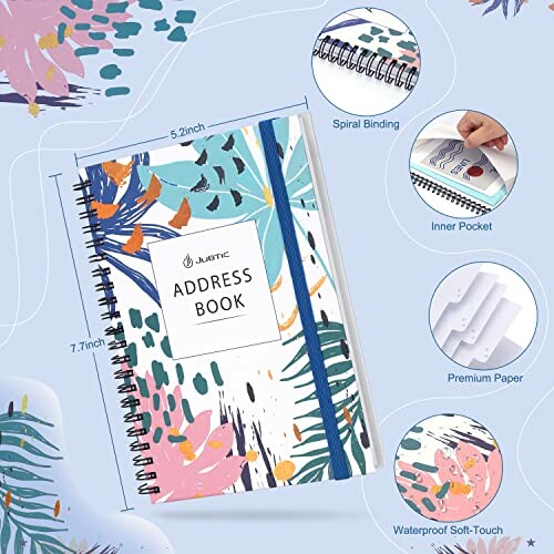Colorful address book with spiral binding and elastic band.
