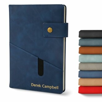Blue notebook with pen holder and stack of colorful notebooks.